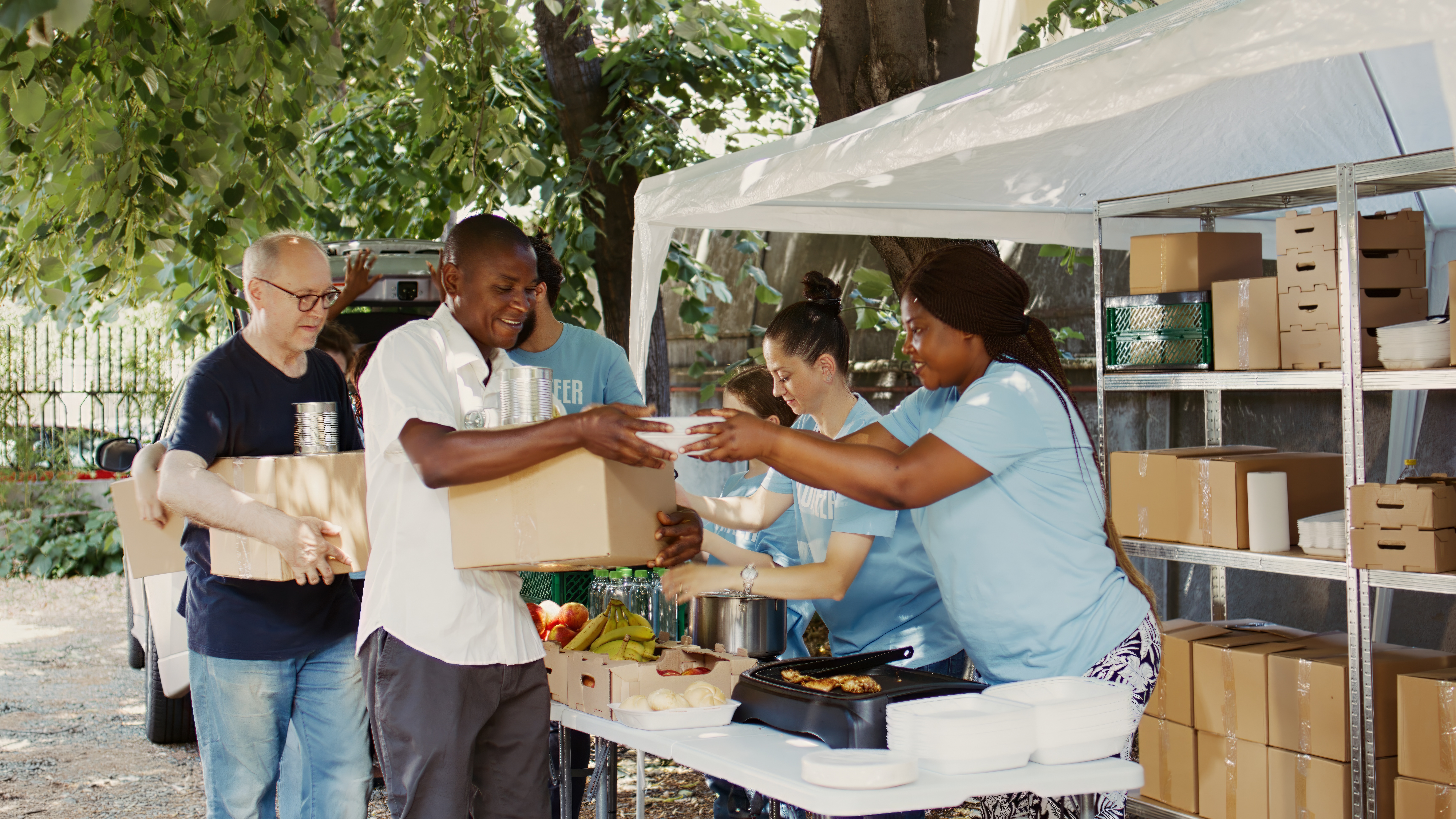 A group of In Touch Foundation volunteers serving food at the mobile kitchen